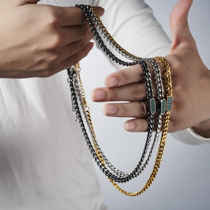 Titanium steel shell necklaces in gold, silver and black with geometric green accents