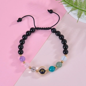 Detailed shot of Libra zodiac blue sandstone bracelet with adjustable braided rope