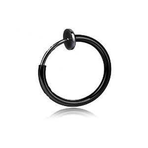 Detail of a black punk clip-on earring with cross pendant on a white background