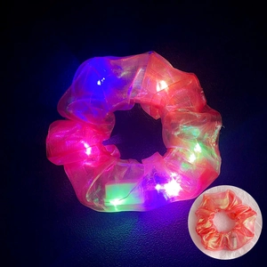Detail of LED light-up hair scrunchie with colorful mermaid sheer fabric and glowing effect