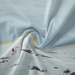 Close-up of light blue bohemian tapestry fabric with abstract printing and soft textures