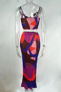 Detailed back view of a pleated two-piece set featuring abstract geometric print and slim fit