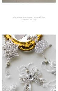 Detailed close-up of acrylic Christmas ornaments on a gold vintage mirror