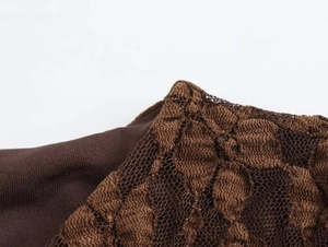 Close-up of deep coffee lace texture and knit fabric splicing on the long sleeve dress