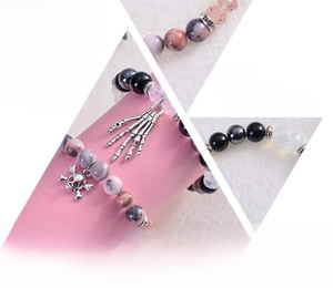 Detail of Halloween skull bracelets with natural stones and metal bone charms