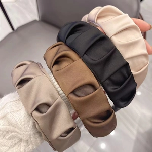Pack of four pleated fabric headbands in beige, brown, black, and khaki satin material
