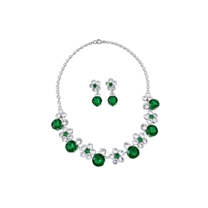 Elegant silver flower jewelry set with emerald stones and diamond necklace on white background