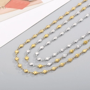Polished 18k gold and silver stainless steel heart chain necklaces in a diagonal layout