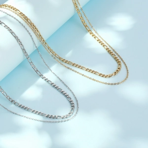 Double-layered stainless steel Figaro and cable chain necklace in gold and silver