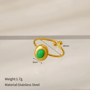 Detail view of 18k gold-plated stainless steel ring with green oval turquoise stone