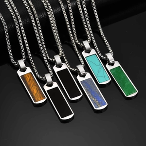 Detail view of rectangular pendants with lapis and tiger eye stones on steel chains