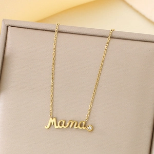 Macro detail of 18K gold-plated Mama necklace featuring a sparkling round zircon stone