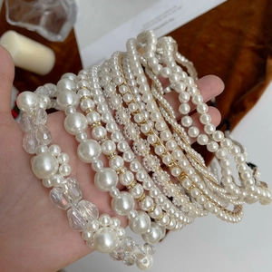 Selection of elegant pearl and crystal headbands in various minimalist gold designs
