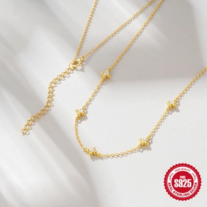 Elegant gold-plated S925 sterling silver clover necklace with inlaid white zircon stones
