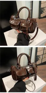 Detailed side view of dark brown high-gloss saddle bag with dual front flap pockets