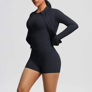 Three-piece black yoga set with zipper jacket, short sleeve crop top, and high waist shorts