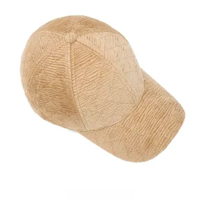 Top view of beige corduroy baseball cap featuring premium diamond quilted stitching details