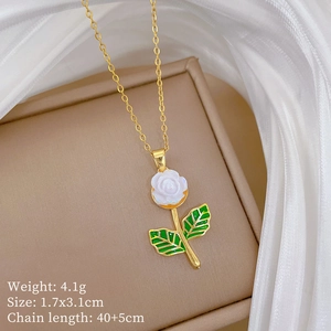 Detail of gold titanium necklace featuring a white rose pendant with product specifications
