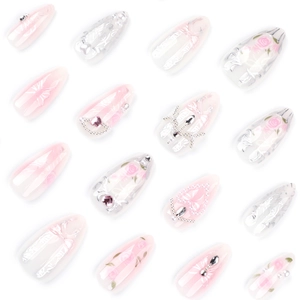 Pink rose press-on nails with 3D bows and pearls on long almond gradient nails