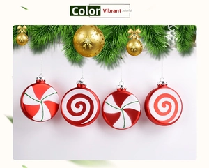 Detail of red and white peppermint style Christmas baubles with spiral candy pattern