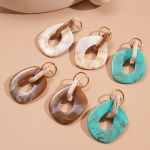 Irregular resin geometric square earrings in cream, caramel, and mint green colors