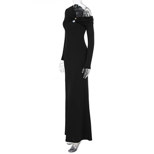 Detail of elegant black knit maxi dress with asymmetric off-shoulder metal hardware