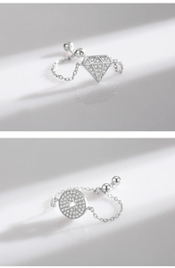 Detailed macro view of S925 sterling silver chain rings with sparkling zircon inlay