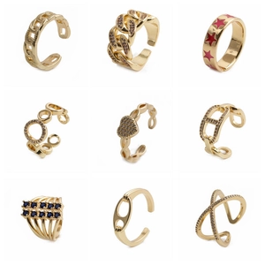 Set of nine gold-plated rings with hollow chain, heart, star and zircon designs