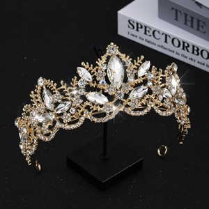 Detailed macro view of luxury bridal crown with marquise crystals and golden metal design