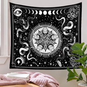 Detail of gothic tapestry featuring goat skull and moon phase in a cozy room setting