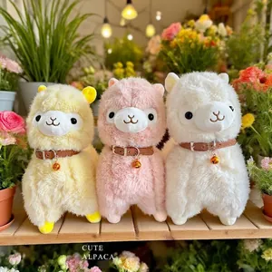 Fluffy alpaca plush dolls with collars and bells shown in a floral shop setting
