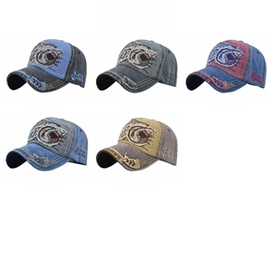 Close-up of vintage washed baseball caps with shark embroidery in five distinct colors