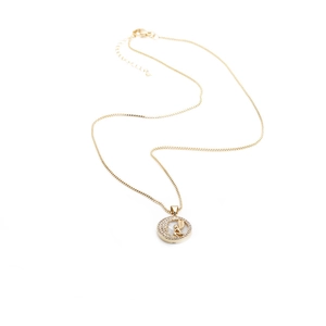 Golden necklace with circular angel wing pendant and pave-set cubic zirconia on white background