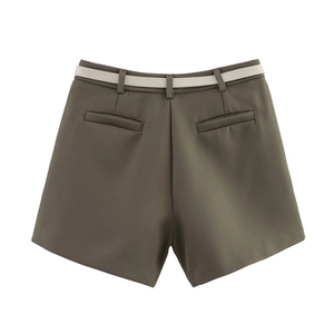 Detail of army green high-waisted shorts with white belt and rear welt pockets