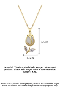 Detailed macro view of gold tulip pendant with zircons and titanium steel chain
