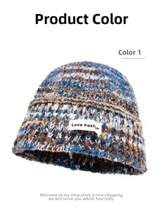 Detail of the knit texture and Love Fashion woven label on the gradient bucket hat