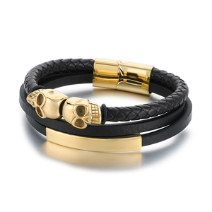 Men's multilayer black braided leather bracelet with golden skull beads and magnetic clasp