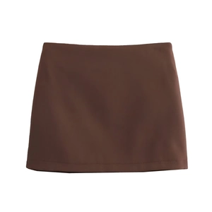 Close-up of a brown mini skirt with smooth fabric texture and professional flat lay styling