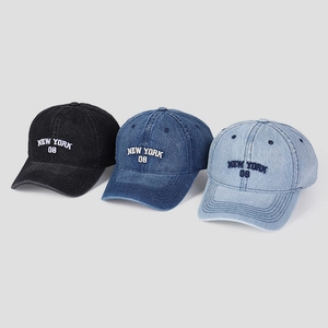 Detailed embroidery of New York 08 on three washed denim baseball caps in various blue tones