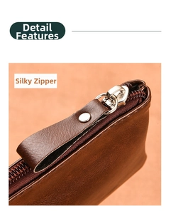 Macro detail of brown leather wallet featuring a smooth silver metal zipper and neat stitching