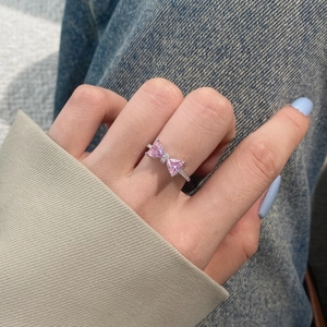 Detailed view of S925 silver ring featuring pink heart stones in a butterfly shape and small diamonds