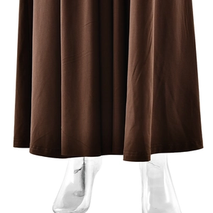 Detailed view of brown floor-length evening gown with draped fabric and mermaid tail hem