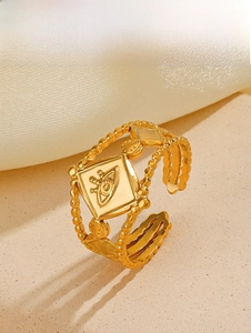 Macro view of gold adjustable eye ring with geometric rhombus and beaded bands