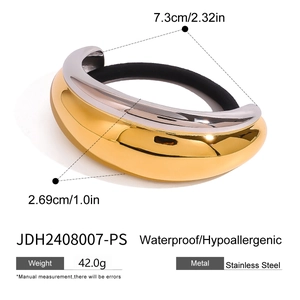 Detail view of two-tone stainless steel U-shaped hair ring with gold and silver finish