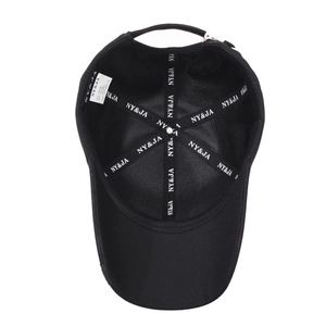 Internal structure of black baseball cap showing six-panel stitch and NY&JA sweatband