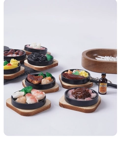 Detailed view of miniature teppanyaki food charms featuring steak and shrimp on wood trays