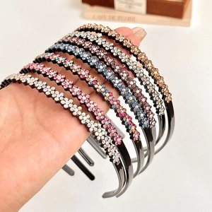 Wavy rhinestone headbands with floral patterns in multiple colors for women and girls