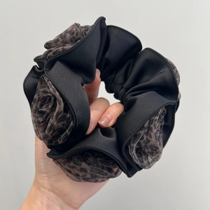 Elegant oversized double-layer scrunchie featuring black fabric and leopard print mesh