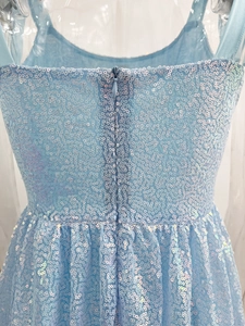 Close-up of the light blue sequin dress featuring a concealed back zipper and fine mesh
