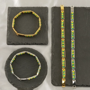 Macro shot of titanium steel beaded bracelets with rectangle links and colorful beads